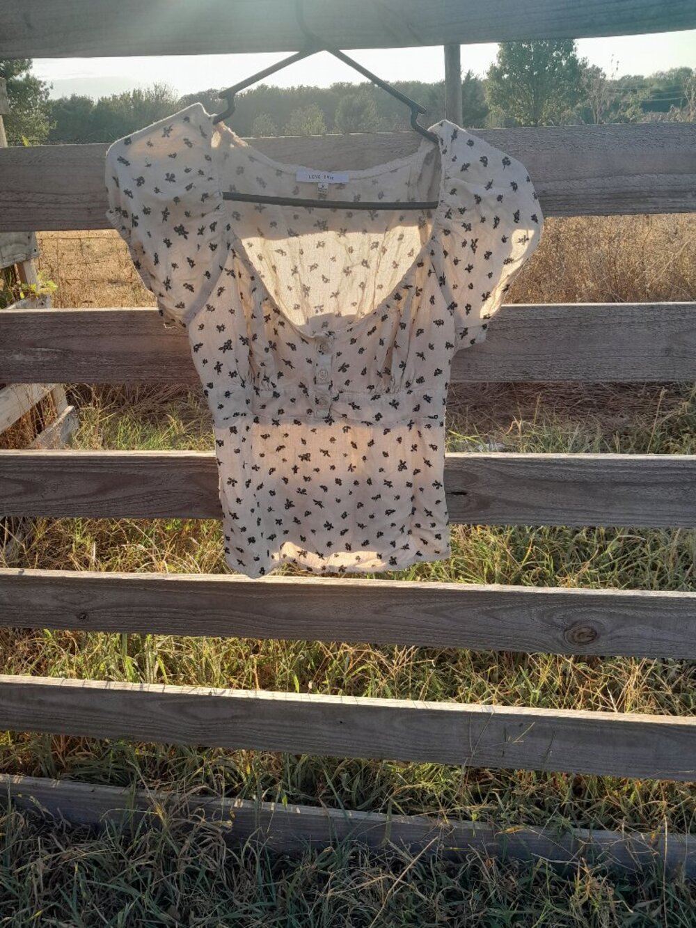 Tan babydoll top with black flower print